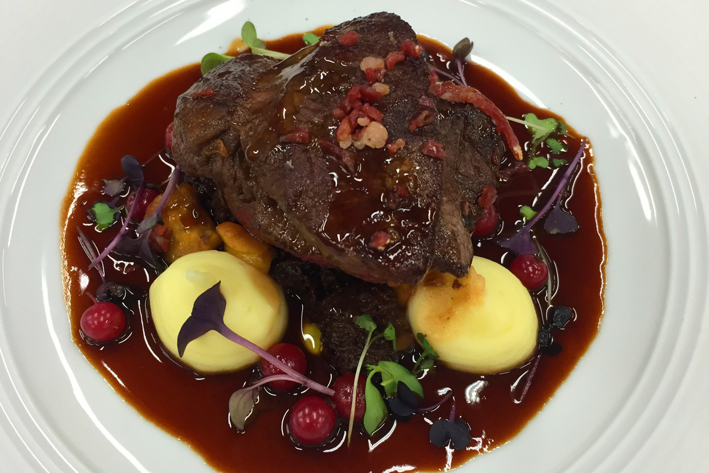 IFT Educational Restaurant: Grilled Pork Tenderloin with Homemade Bacon, Hasselback Potato and Demi Glace