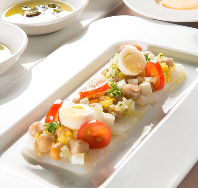 Fado: Marinated cod carpaccio with chickpeas, tomatoes and egg salad